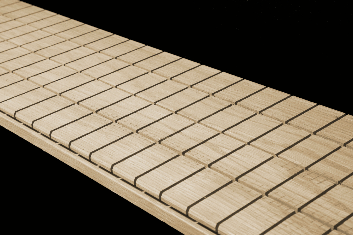 Longitudinal and transverse cuts on the back of a solid board
